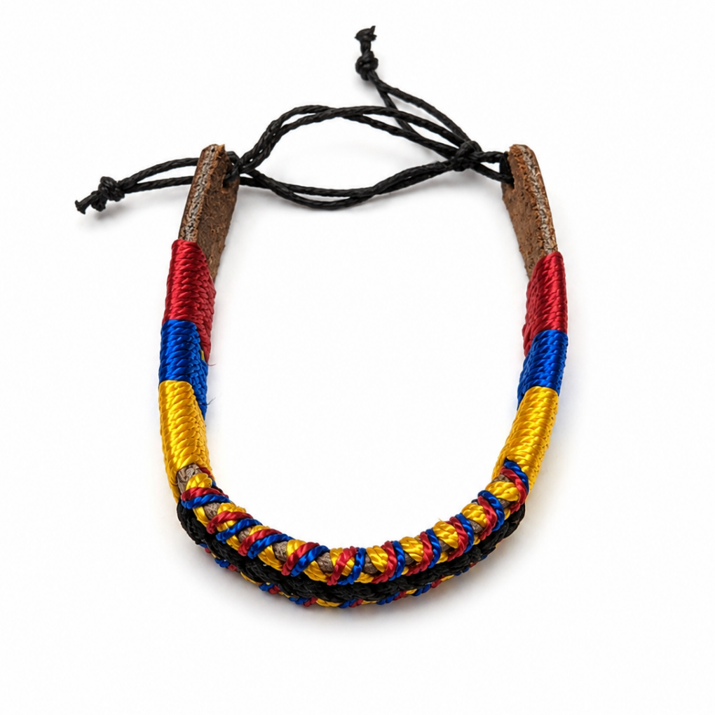 Handmade Colombian woven adjustable bracelet in red, blue and yellow