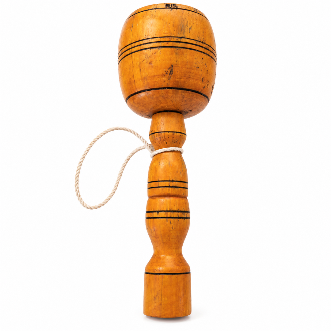 Traditional Colombian balero wooden cup-and-ball game on white background