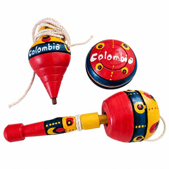 Colombian traditional toy set with coca, trompo and yoyo on a white background