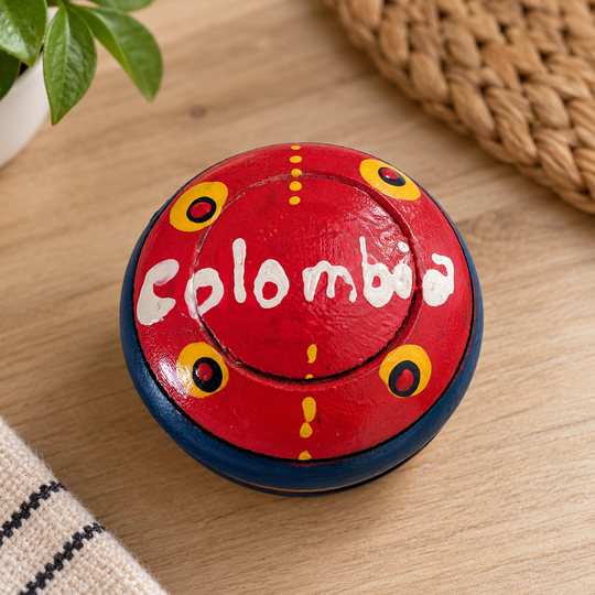 Hand-painted Colombian yoyo on a light wooden table