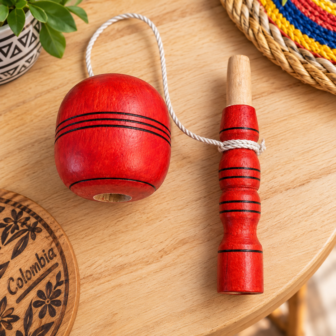 Traditional Colombian red coca game displayed in a bright artisan setting