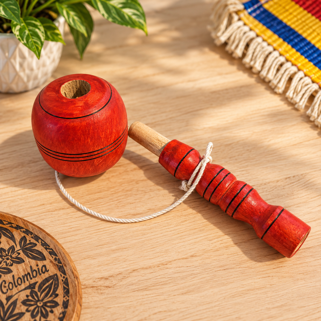 Traditional Colombian red coca wooden game on a warm light tabletop