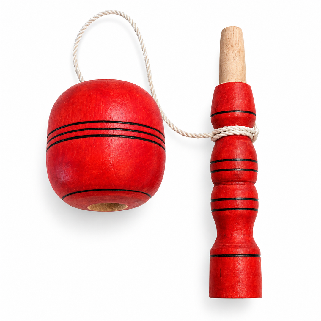 Traditional Colombian red coca wooden cup-and-ball toy separated on white background