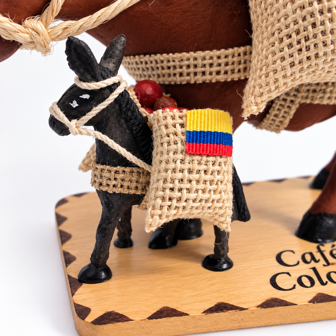 Detail of miniature Colombian coffee donkey with woven sack and flag