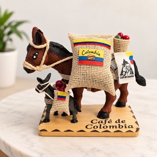 Colombian coffee mule figurine displayed on a light table