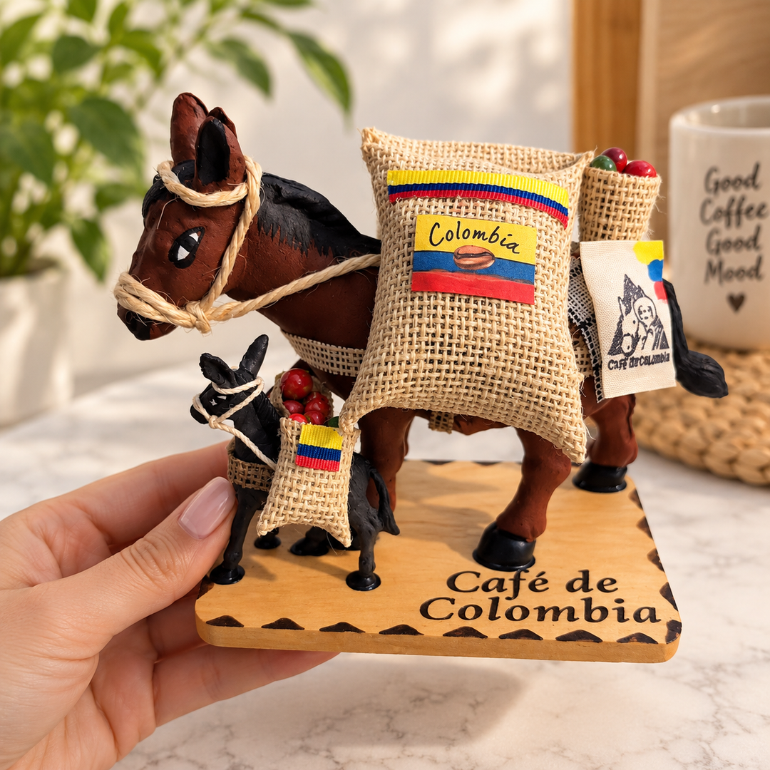 Hand holding Colombian coffee mule figurine showing collectible size