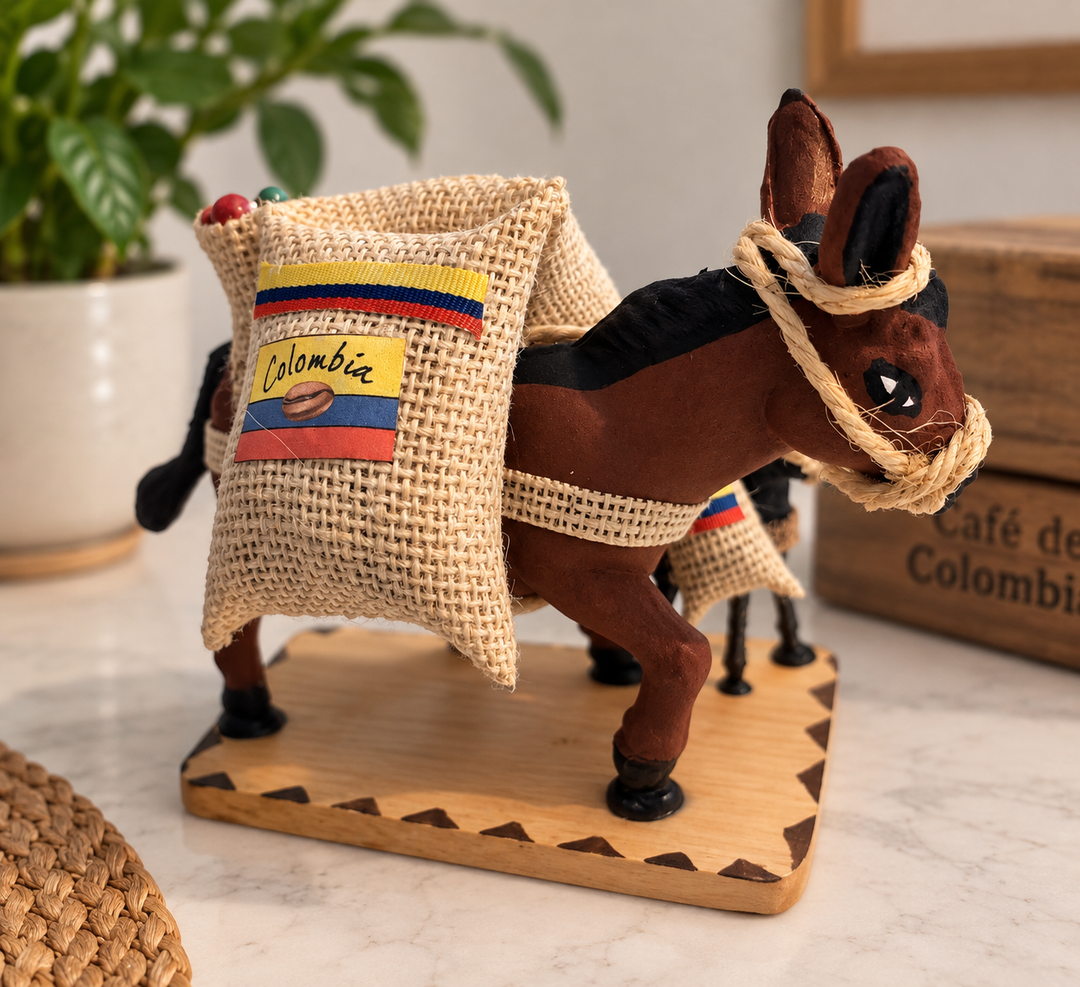 Handcrafted Colombian pack mule souvenir in a warm coffee-themed setting
